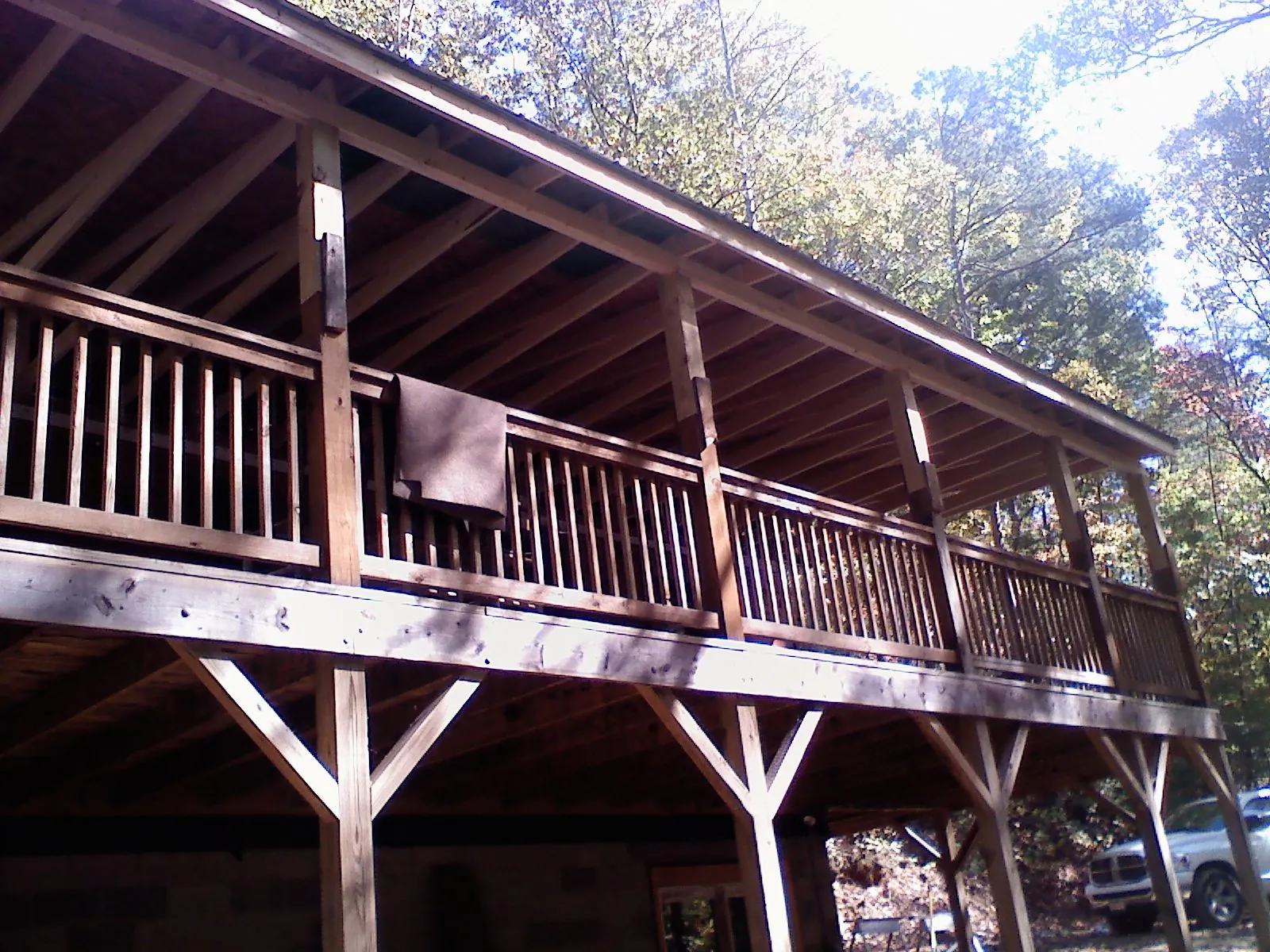 Timber framing under a new elevated porch and deck — Roof Leak Repair in Maple City by Roofing Brothers